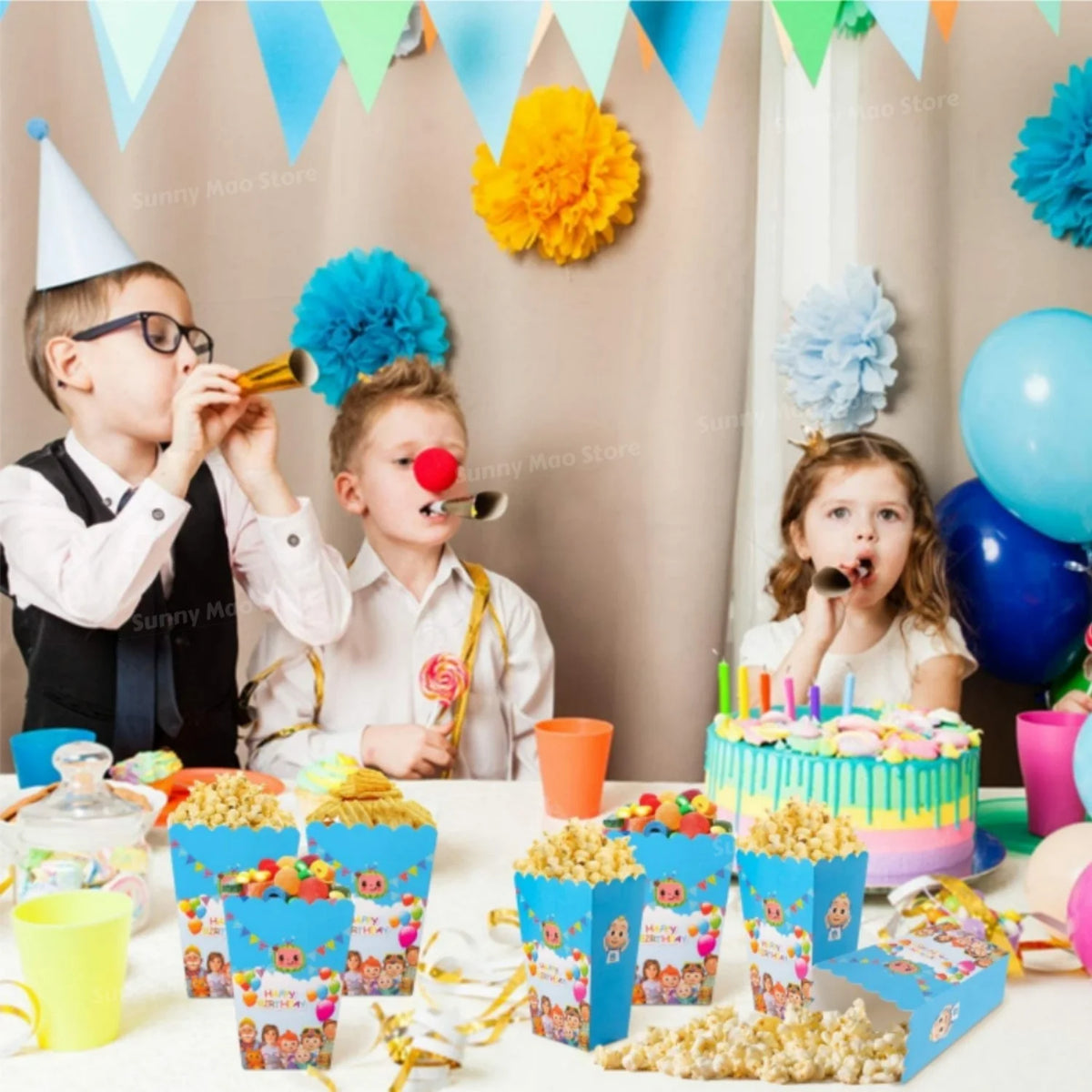 A colorful party supplies kit featuring balloons, tableware, and treats for a children's celebration.