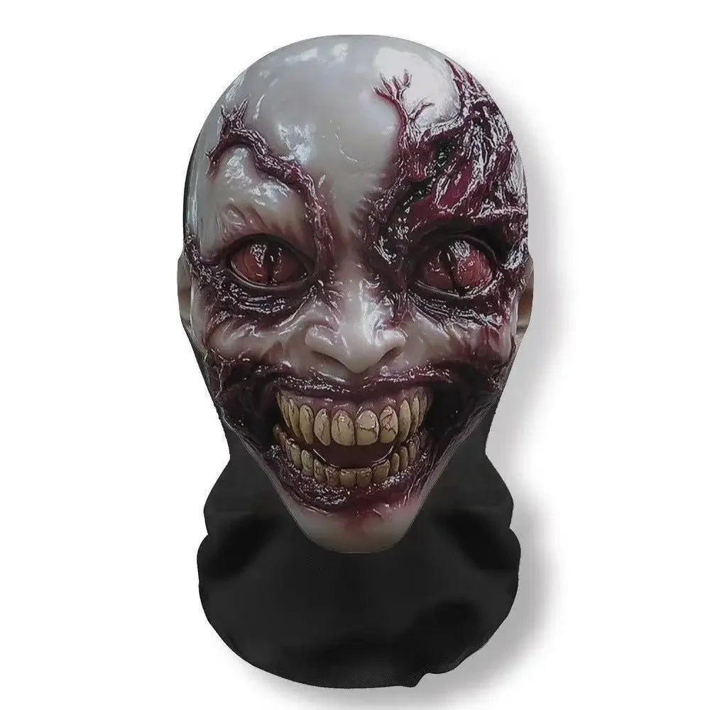 A gruesome, cracked face mask with dark purple and red markings for a carnival or horror cosplay.