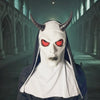 A white full-face latex mask with red eyes and dark clothing, set in a gothic architectural interior.