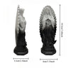 A gray resin statue of Our Lady of Guadalupe with a halo and draped garment.