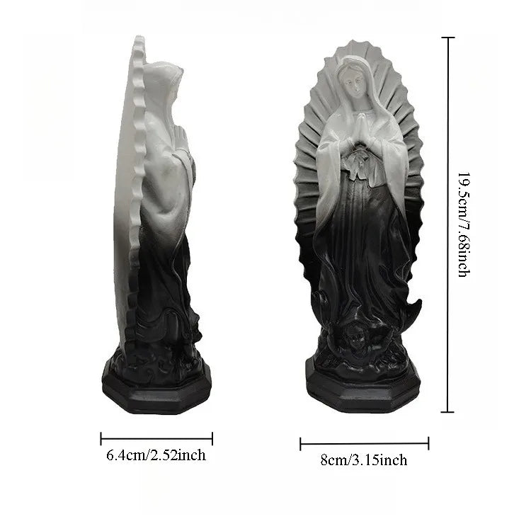 A gray resin statue of Our Lady of Guadalupe with a halo and draped garment.