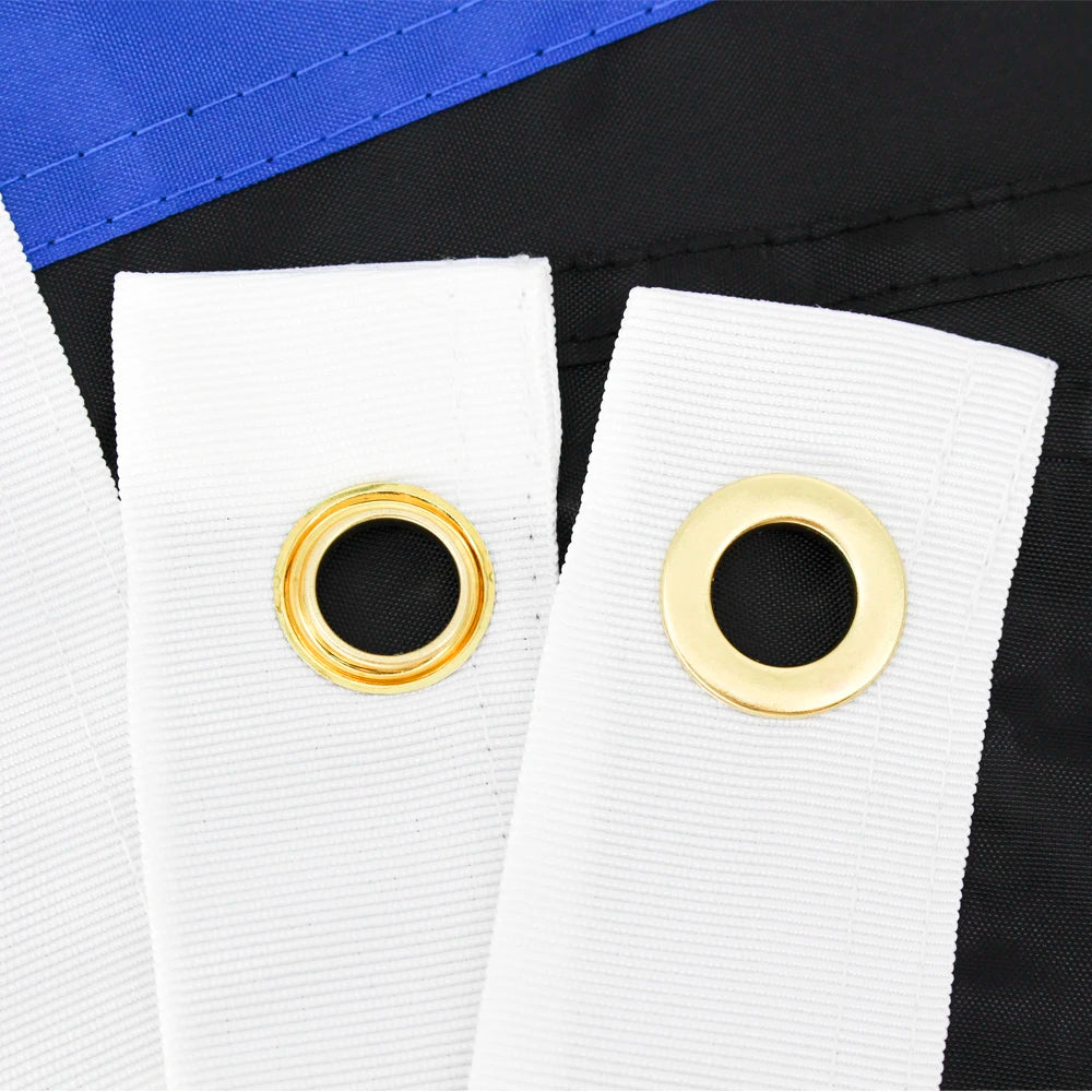 White flag with gold grommets against a black background