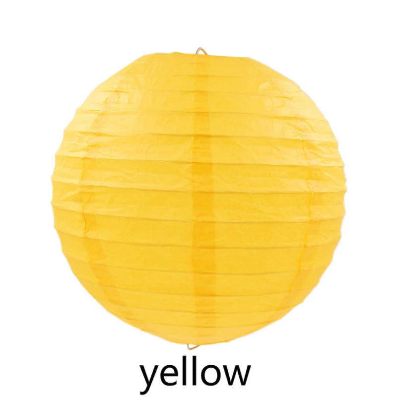 A round, bright yellow decorative paper lantern.