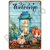 A vintage metal tin sign featuring a welcome message, an orange pumpkin, a starfish, and various autumn-themed natural elemen