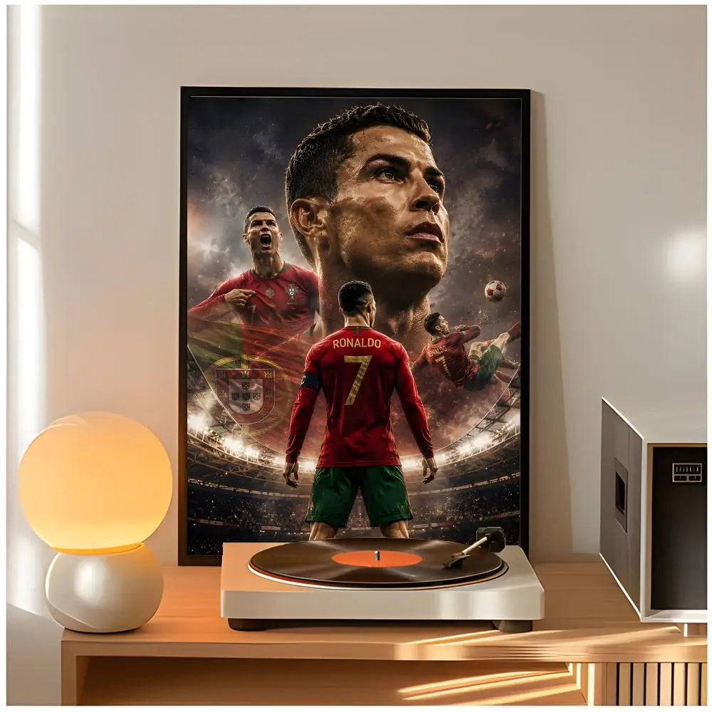 A framed poster of Cristiano Ronaldo in a determined pose displayed on a wooden table.