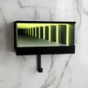 A black rectangular keychain holder featuring an LED tunnel effect light inside.