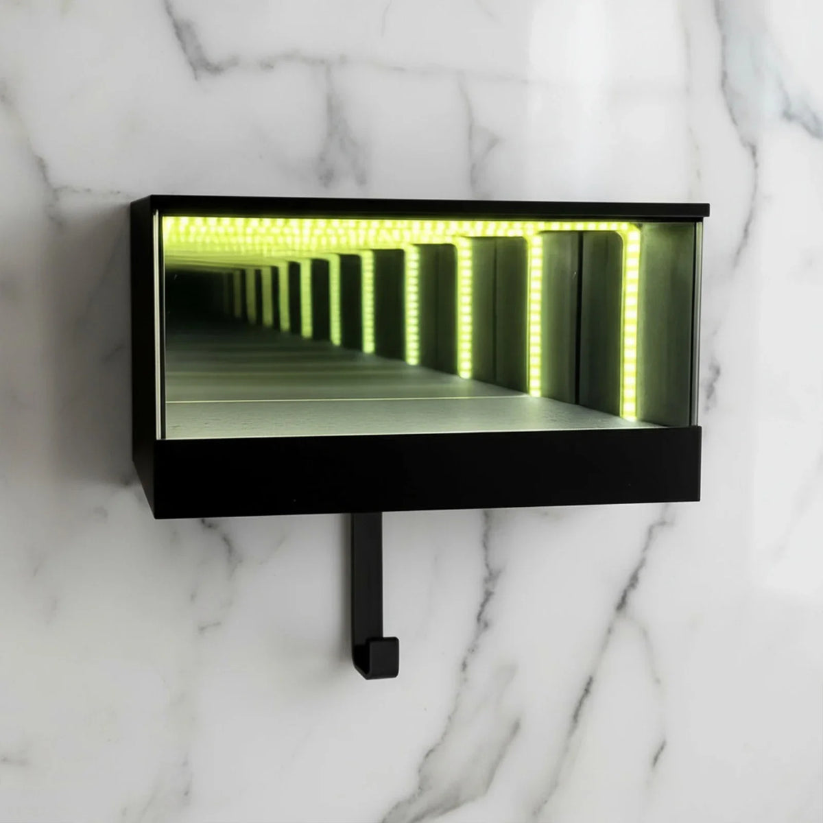 A black rectangular keychain holder featuring an LED tunnel effect light inside.