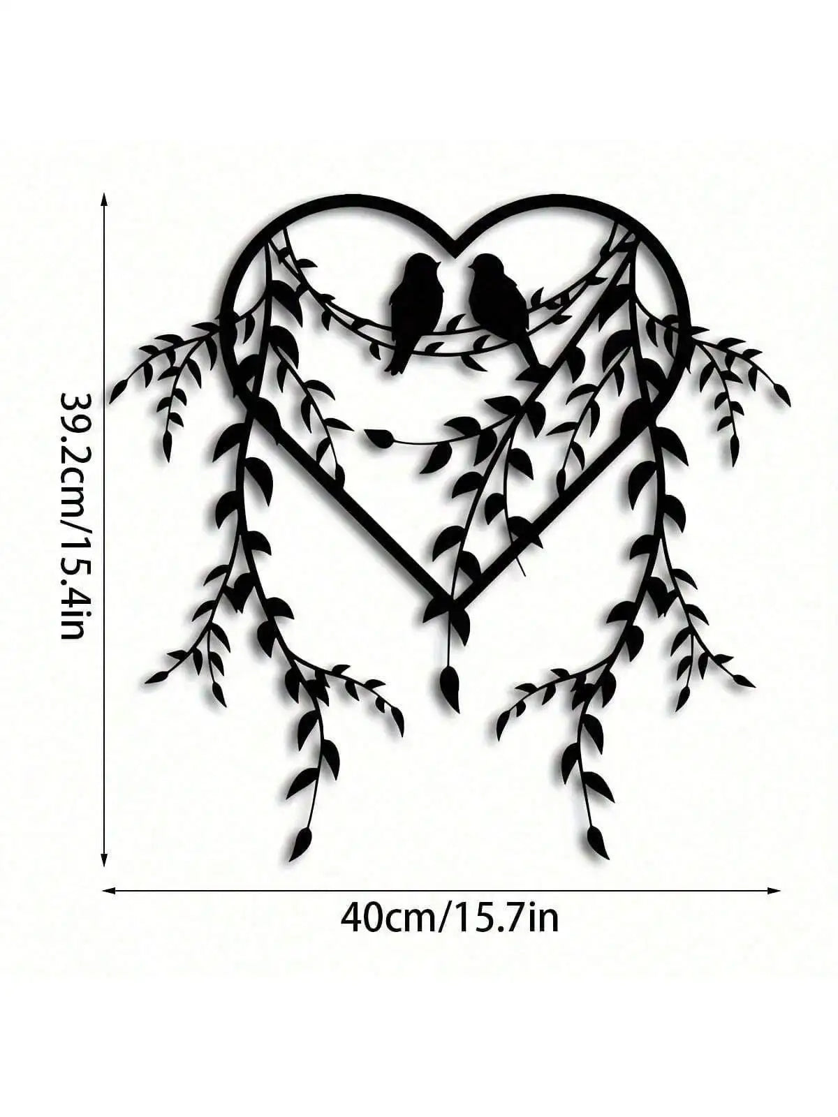 Black metal wall decor featuring a heart shape adorned with vines and two birds