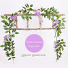 A silk wisteria vine garland draped over a wooden trellis for wedding and home decor.