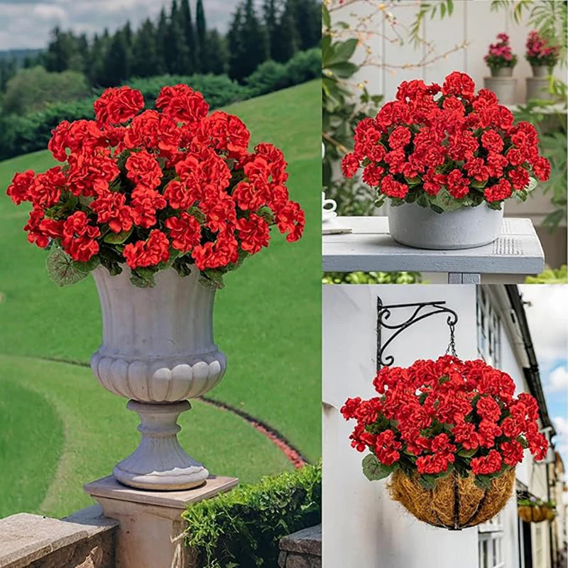 A vibrant bouquet of red silk faux geranium flowers displayed in a classical vase on a stone ledge.
