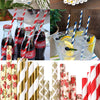 A collection of colorful striped and polka dot paper drinking straws in various patterns and colors.