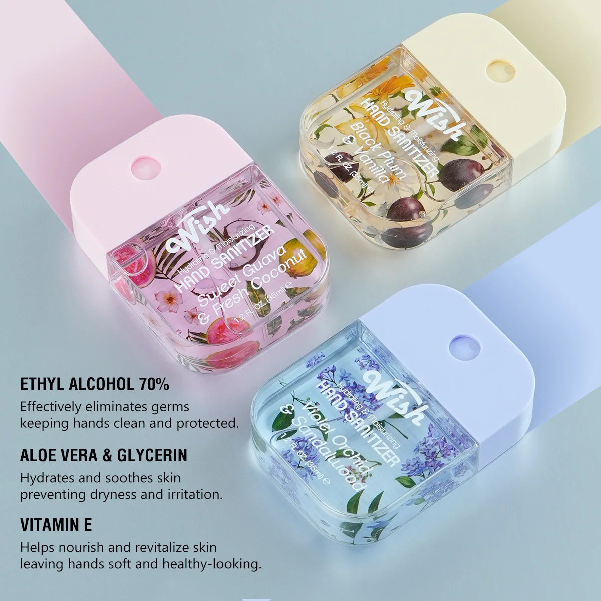 A collection of clear glass hand sanitizer bottles with white caps and various colored liquid sanitizers.