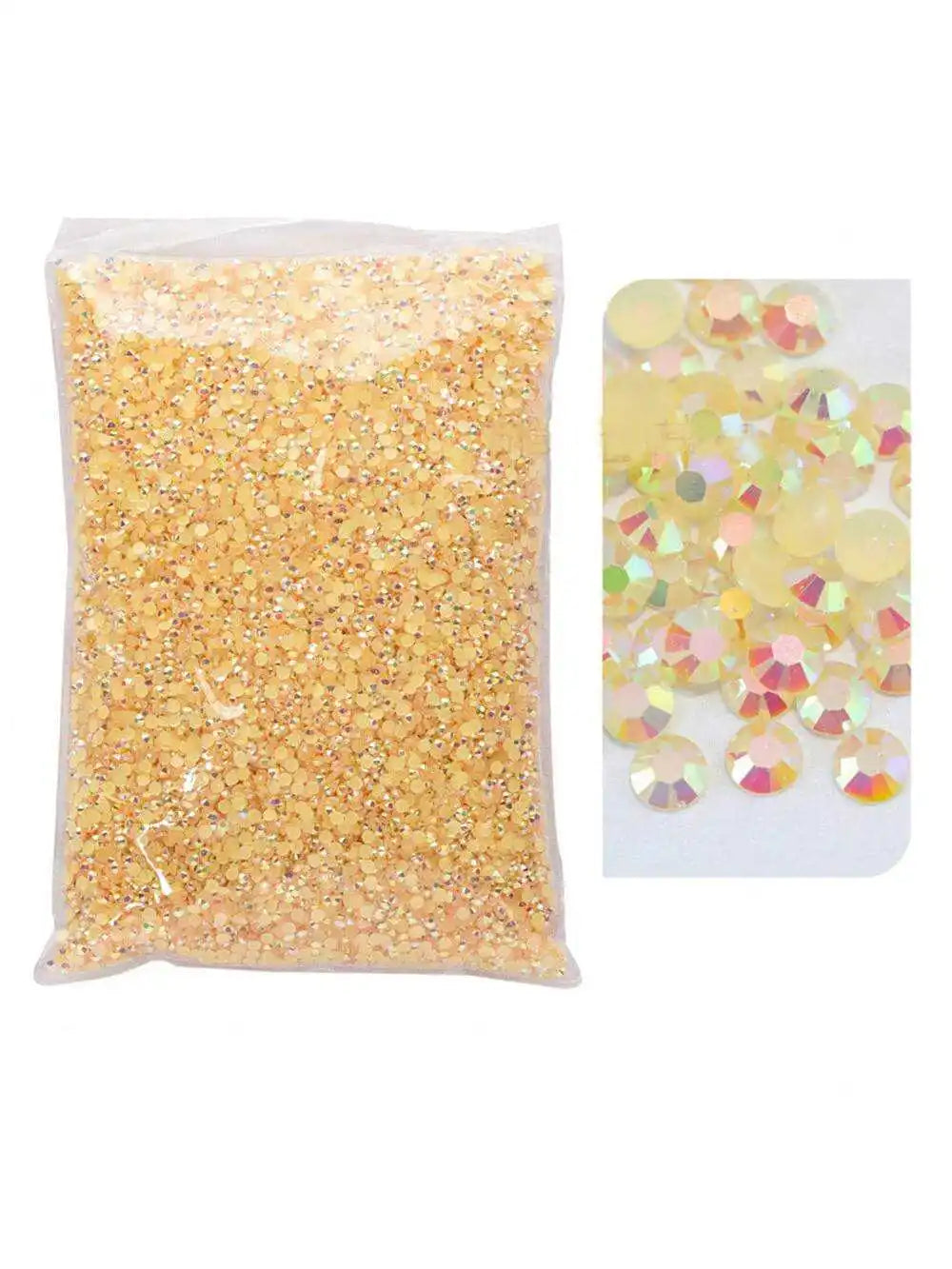 Bag of gold glitter and loose yellow and pink resin rhinestones