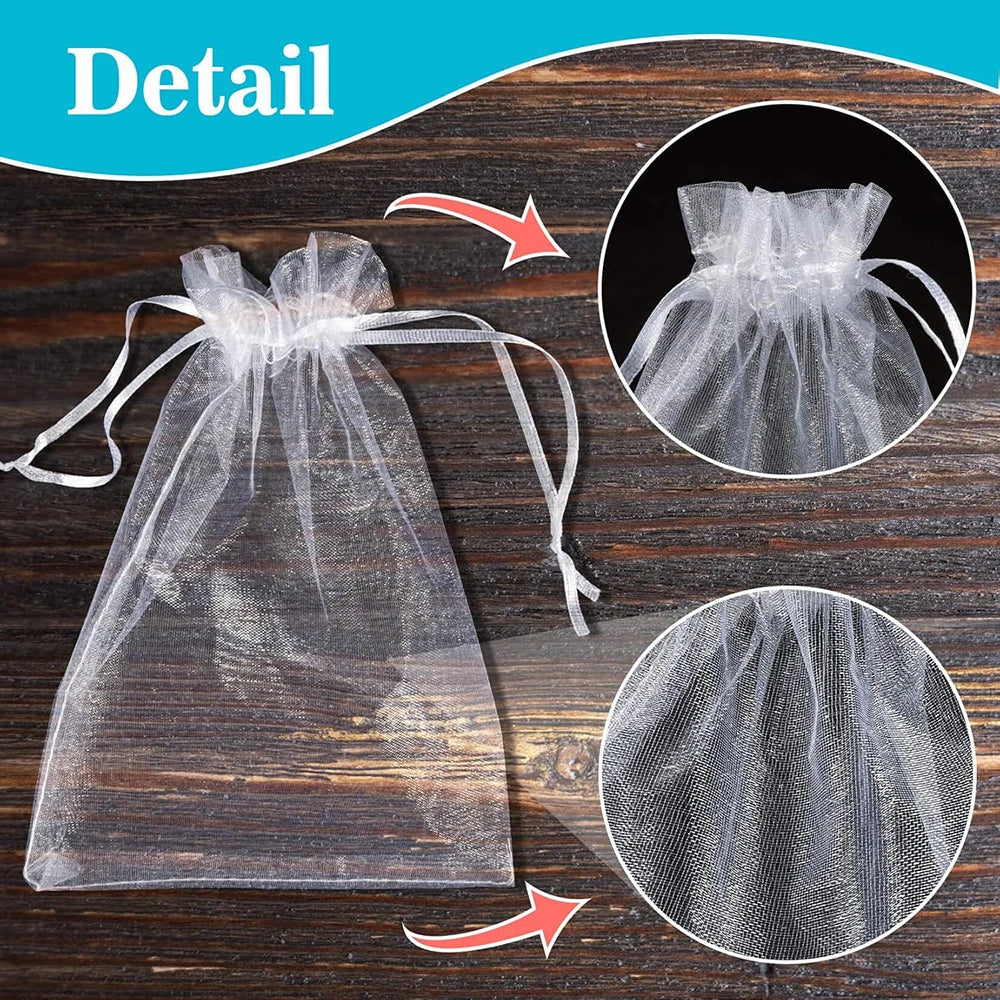 Detail shot of an elegant white organza drawstring gift bag and a circular mesh bag on a wooden surface.