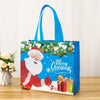 A blue festive tote bag with a Christmas design featuring Santa, greenery, and the text Merry Christmas.