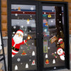 A set of festive Christmas window stickers featuring a snowman, deer, and Santa Claus on glass doors.
