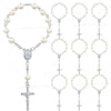 A set of mini baptism rosary favors with crosses in assorted styles and silver color.