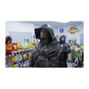 A person wearing a black leather hood is standing in a grocery store aisle, looking towards the camera.