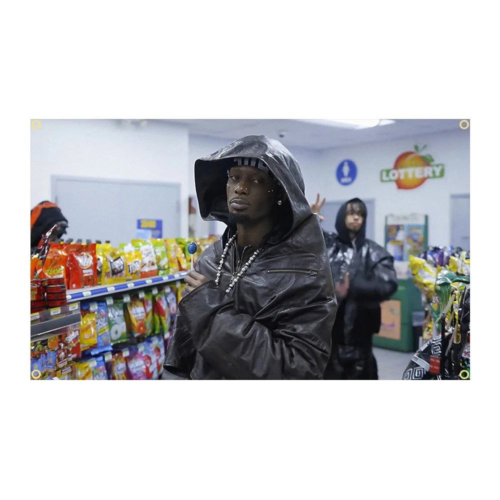 A person wearing a black leather hood is standing in a grocery store aisle, looking towards the camera.