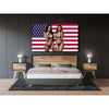 A woman in a bikini stands against an American flag tapestry backdrop above a modern bed.