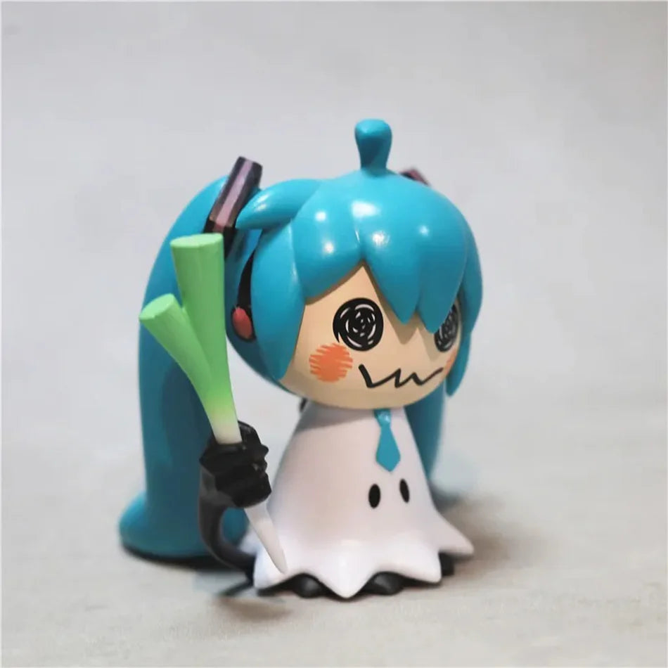 A 7cm PVC collectible statue of Hatsune Miku anime character with blue hair and a white outfit holding a green object.