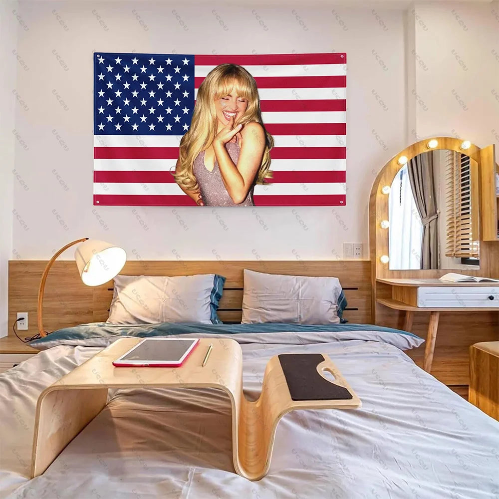 A tapestry featuring the American flag design displayed on a wall above a wooden bed.