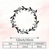Black metal wreath for wall decor with size specifications showing 12 inch or 30 cm height.