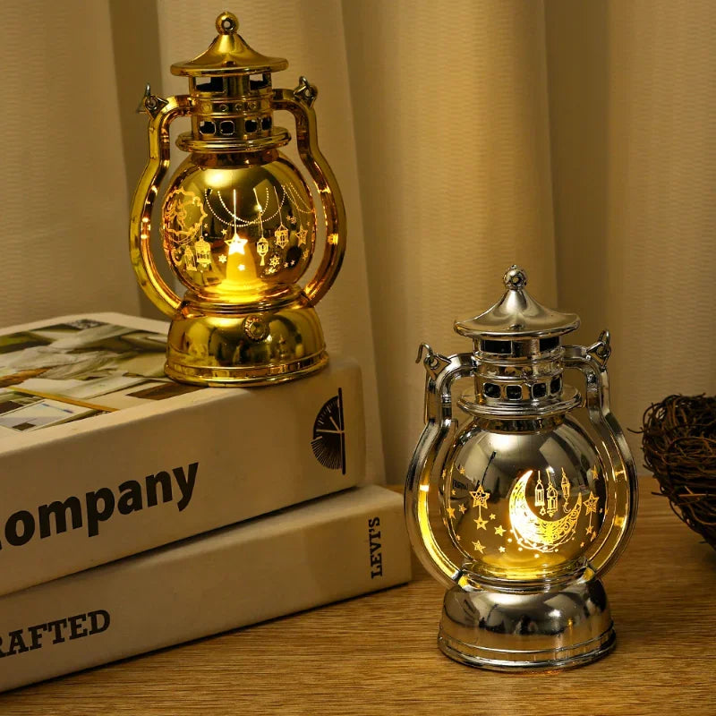 A pair of brass and silver LED lanterns with warm glow used as home and party décor.