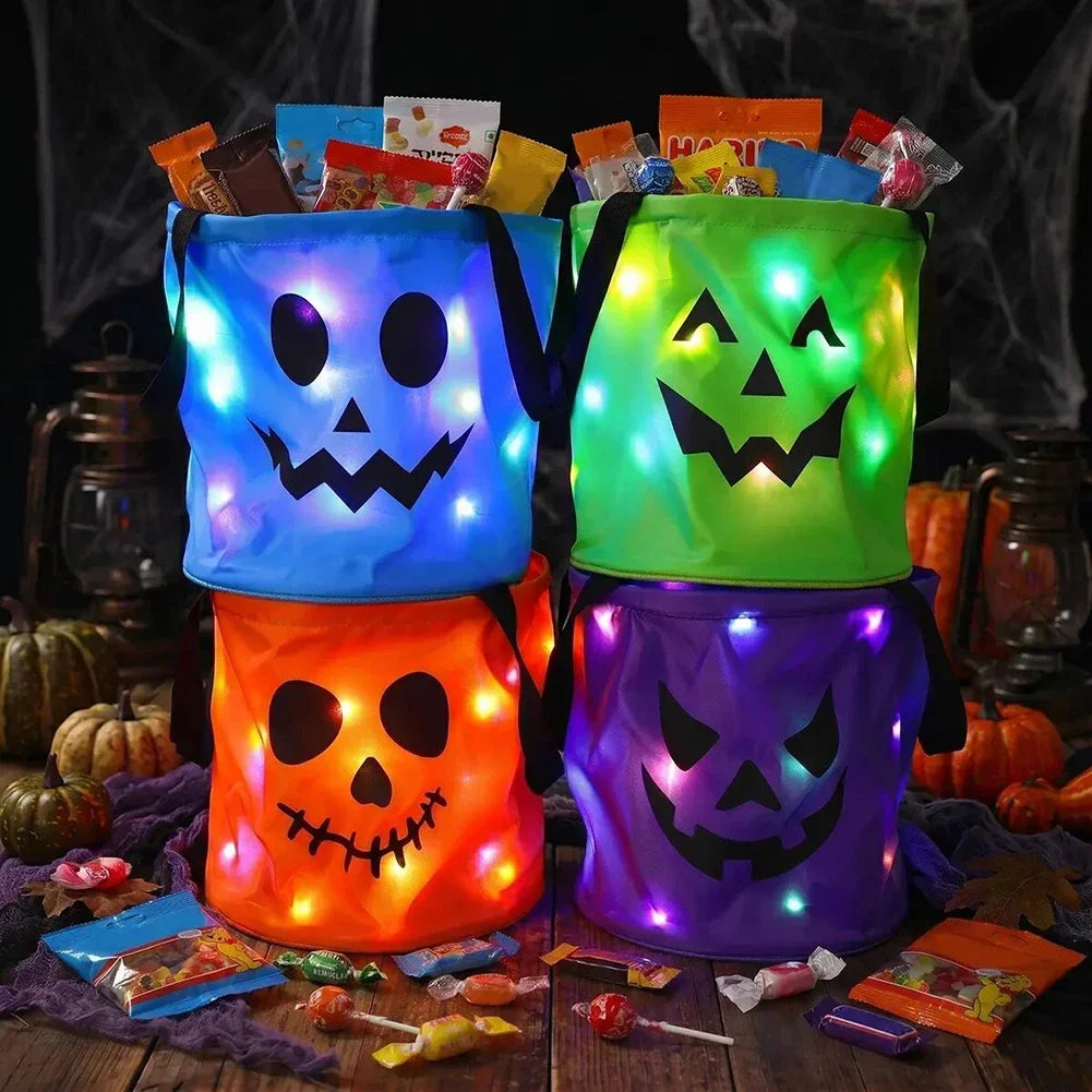 A stack of LED illuminated Halloween trick-or-treat bags in blue, green, and orange.