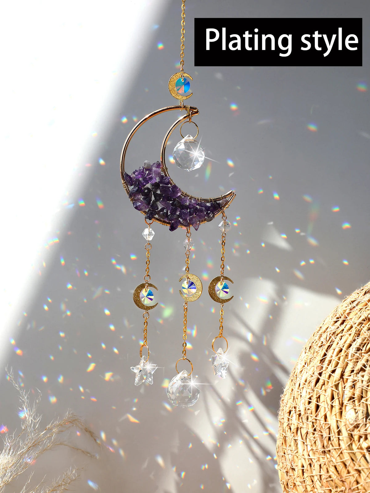 A handcrafted moon crystal suncatcher featuring a purple crescent pendant and dangling prism beads.