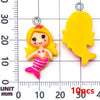 Yellow resin mermaid princess charm with pink striped tail and crown