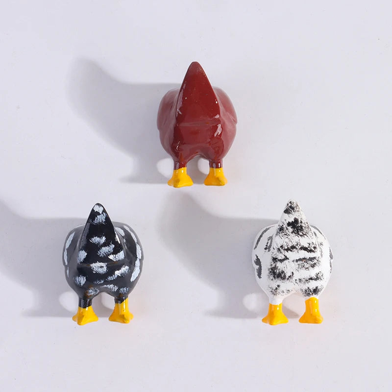 A set of three playful chicken butt fridge magnets featuring a brown, black and white patterned chicken.