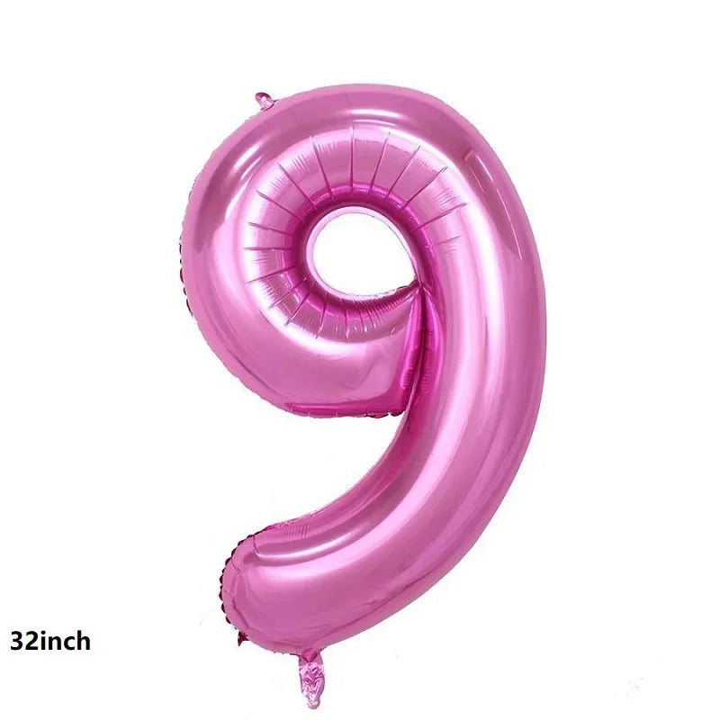 A large, pink foil balloon shaped like the number 9 for party decorations.