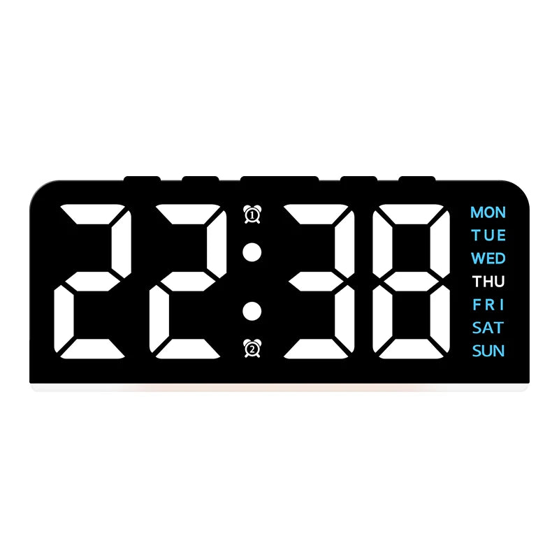 A black digital alarm clock displaying the time 22:38 with a seven-day display.