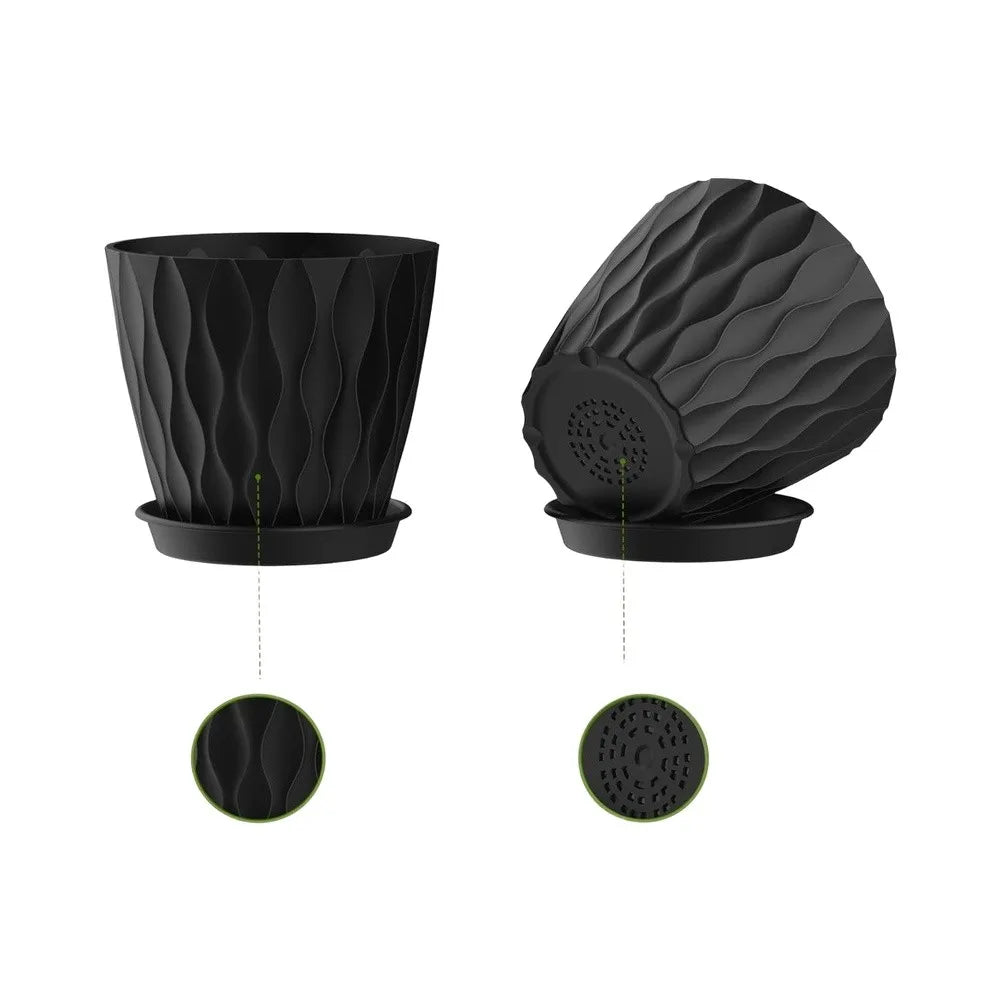 A set of six round black plastic plant pots with drainage saucers.
