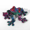A colorful, movable 3D printed tree frog ornament with vibrant green and purple scales.