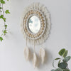 Miroir rond en macramé mural avec des fibres naturelles tressées et de la frange