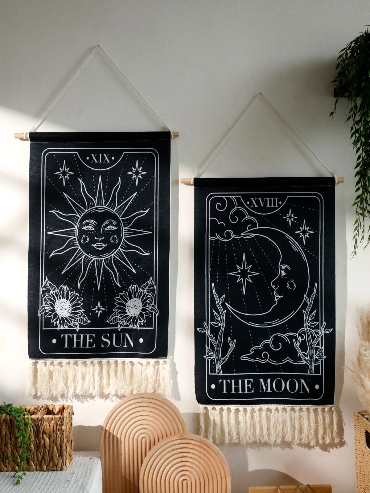 Black sun and moon boho wall tapestry featuring line art of the sun and moon