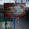 A rusted metal sign with engraved text reading Asylum for the Criminally Insane Family Entrance mounted on a chain-link fence