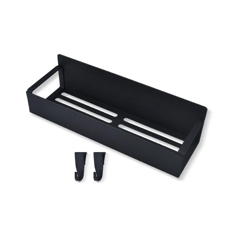 A black magnetic spice rack with two slotted compartments is shown from above.