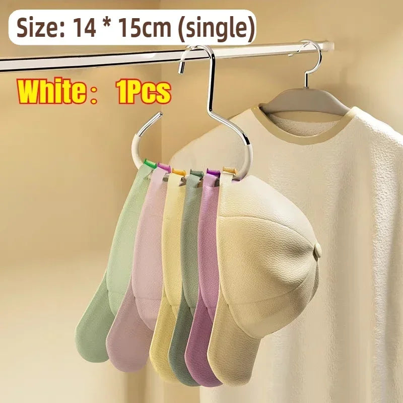 White round multi-purpose closet hooks hanging on a rod with various colored hats and scarves