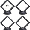 A set of black floating shadow box jewelry display frames with diamond shapes, featuring a silver ring inside.