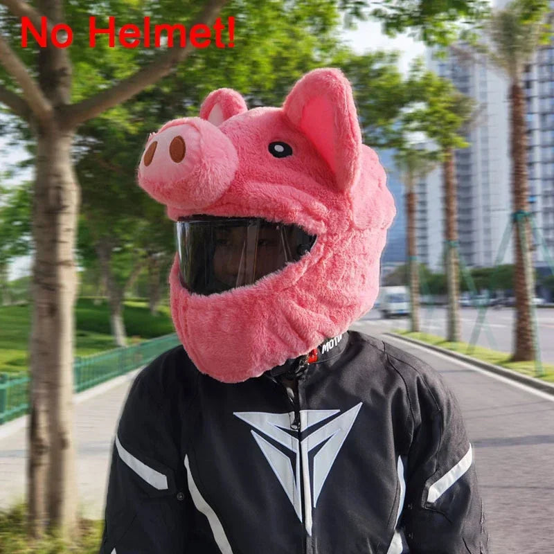 A pink cartoon plush helmet cover worn by a person, shown outdoors.