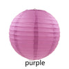 A large, round pink paper lantern with vertical folds.