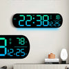 Reloj de pared digital mostrando hora y temperatura, con cambio entre Fahrenheit y Celsius.