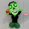 A lime green inflatable Halloween decoration shaped like a monster with glowing eyes and a carved pumpkin accessory.