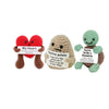 Three handmade knitted plush dolls with hearts and text on them for cozy decor