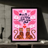 A framed wall art print featuring a pink background with a wild for you quote, leaves, and tiger illustrations.
