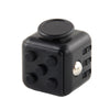 A black fidget cube with a round top and several buttons on the side.