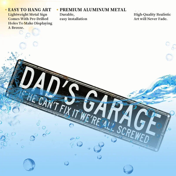 A black metal tin sign with the text Dad's Garage If he can't fix it we're all screwed floating in water.